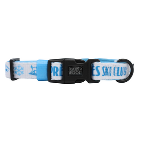 Introducing the Sassy Woof Dog Four Piece Bundle - Après Ski Club: this blue and white adjustable dog collar is adorned with snowflake designs and the words APRÈS SKI CLUB. Perfect as a winter accessory for your pup, it features a durable black plastic buckle branded with Sassy Woof and a sturdy black metal D-ring for easy leash attachment.