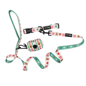Celebrate the season with the Sassy Woof Dog Collar Three Piece Bundle - Cocoa & Cookies—a festive set including a matching leash and waste bag holder. Featuring a green background decorated with gingerbread men, snowflakes, hearts, and candy accents, this cheerful ensemble is perfect for joyful winter walks.