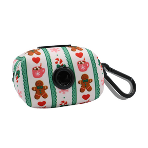 Celebrate the season with the Sassy Woof Dog Collar Three Piece Bundle - Cocoa & Cookies. This festive set includes a rectangular pouch adorned with gingerbread men, hearts, cups, and candy canes on white and green striped fabric. Featuring a black clip and a round black opening for waste bags, it’s the perfect holiday accessory to complement your favorite dog collar.