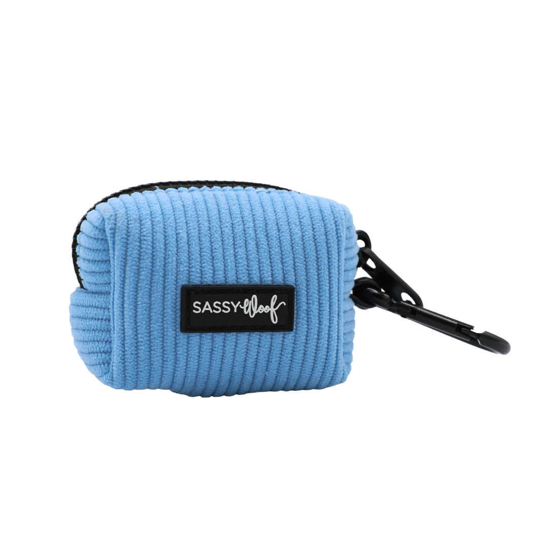Sassy Woof Dog Waste Bag Holder - Morning Frost in light blue corduroy, featuring a black zipper and a black carabiner clip.