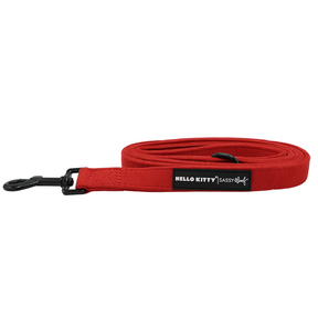 Red coiled Sassy Woof Dog Leash - Hello Kitty® Chic featuring a black metal clasp and black logo patch.