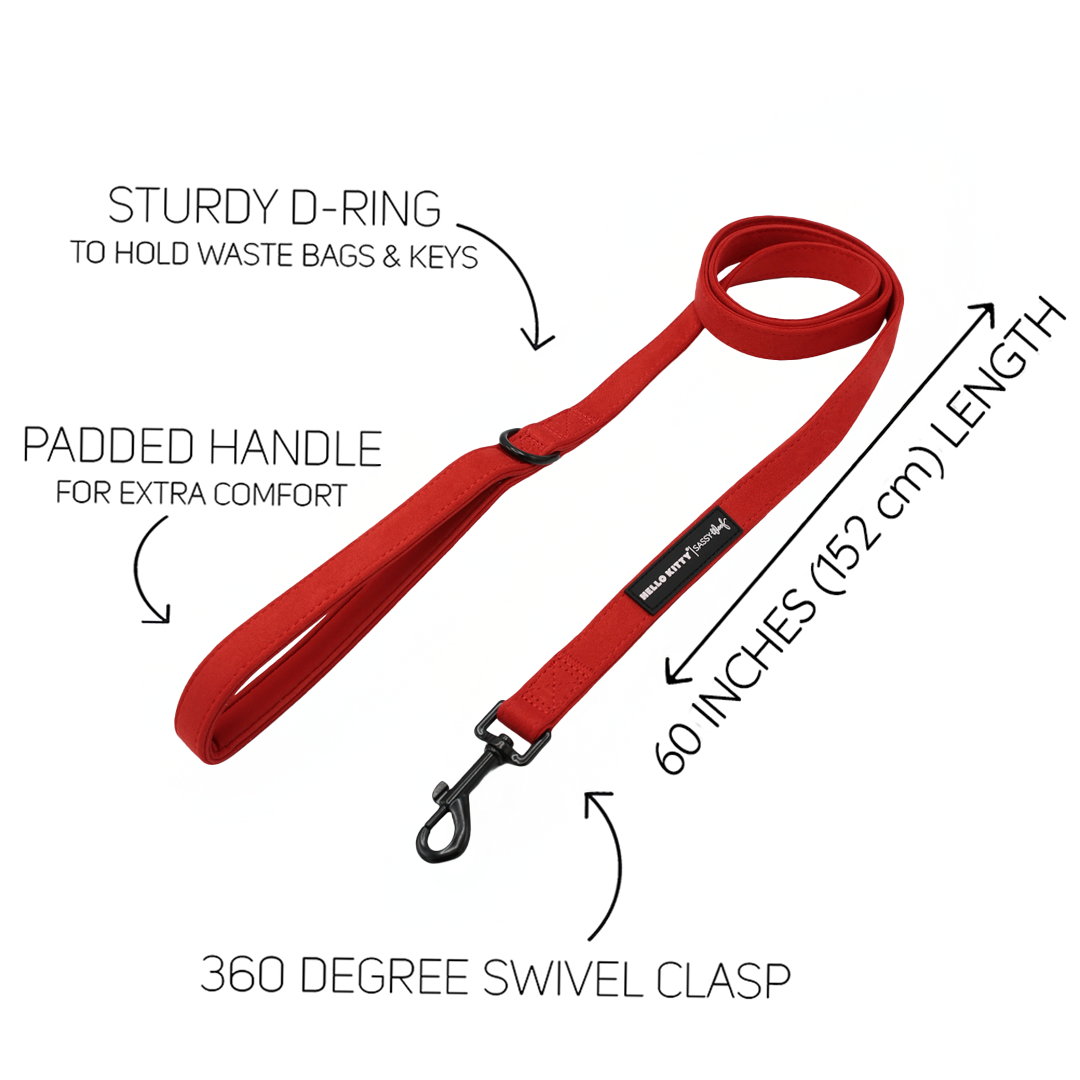 Red Hello Kitty® Chic dog leash by Sassy Woof, featuring a padded handle, a D-ring for accessories, a 360-degree swivel clasp, and a total length of 60 inches.