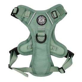 The Sassy Woof Dog Step-in Harness - Sage is a reflective, adjustable harness with black buckles, a central D-ring, and a circular “Sassy Woof, Tails on Trails” chest patch.