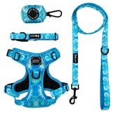 The Sassy Woof Dog Four Piece Bundle - Tropical Tides, featuring a tie dye harness, collar, leash, and waste bag holder, is shown on a white background.
