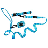 The Sassy Woof Dog Three Piece Bundle - Tropical Tides includes a blue patterned leash, matching tie dye collar, and a roll of waste bags in a Sassy Woof holder.