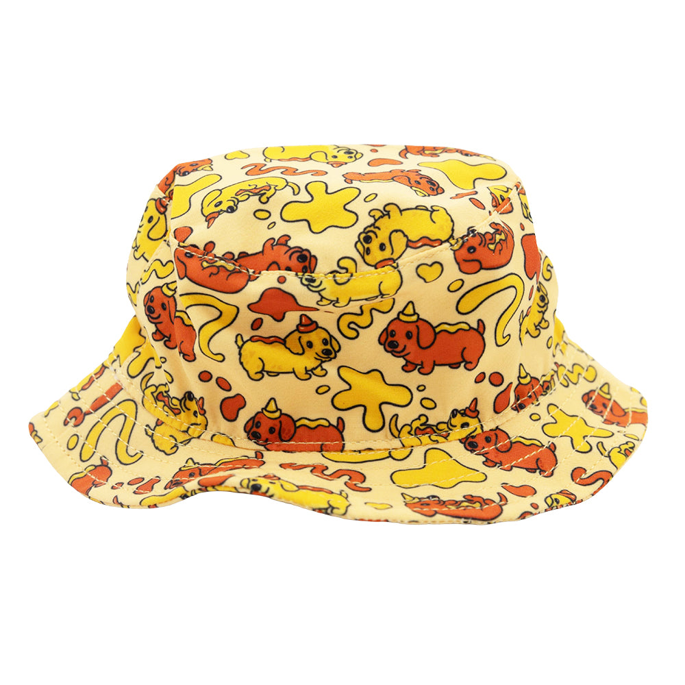 The Dog Bucket Hat - Hot Dawg by Sassy Woof features a yellow dachshund design with playful orange and yellow cartoon cats and abstract shapes, perfect for fans of our weenie-inspired collection.