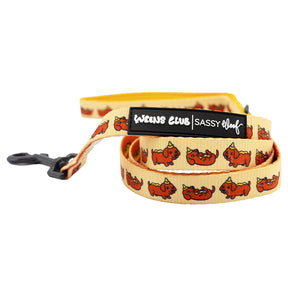 The Sassy Woof Dog Three Piece Bundle - Hot Dawg features a playful yellow leash with cartoon corgis, black plastic clasp, and Weens Club and Sassy Woof labels—ideal for fans of fun weenie dog accessories.