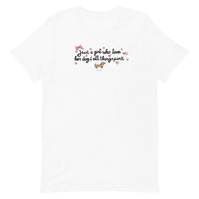 The Sassy Woof "Just A Girl Tee" features a white design with a pink bow, small dog, hearts, and stars. Printed with eco-friendly ink, it says: Just a girl who loves her dog & all things pink.