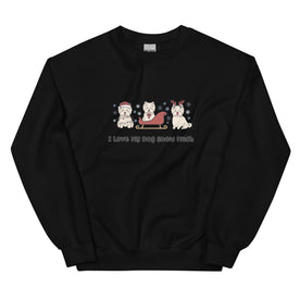The Sassy Woof "I Love My Dog Snow Much" sweatshirt features three Westies in festive gear—Santa hat, sled, and reindeer antlers—with snowflakes and fun text. Cozy, preshrunk black design for winter walkies!.