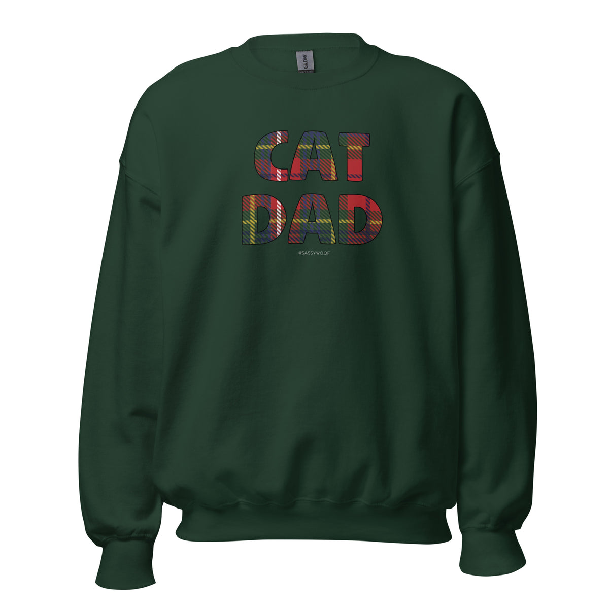 The Sassy Woof Sweatshirt Cat Dad Deck The Paws is a dark green, unisex crewneck featuring "CAT DAD" in large, colorful patterned letters with red, yellow, and green hues and a subtle textured design on the front.