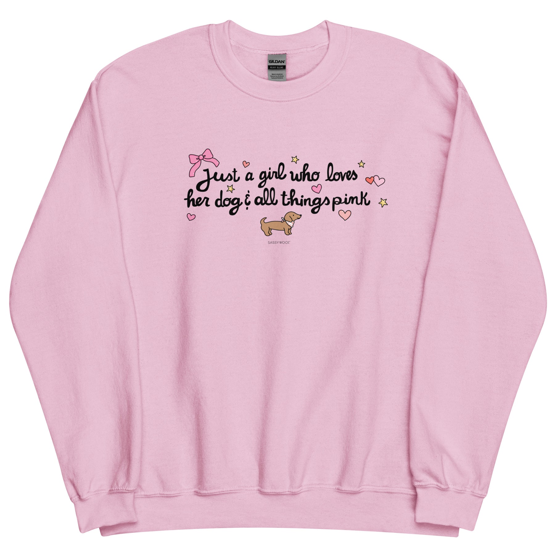 The Sassy Woof Sweatshirt - Just A Girl is a light pink, pre-shrunk, classic fit sweater with "Just a girl who loves her dog & all things pink," pink bow, yellow stars, pink hearts, and a cute brown dachshund illustration.