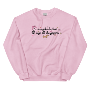 The Sassy Woof Sweatshirt - Just A Girl is a light pink, pre-shrunk top featuring "Just a girl who loves her dog & all things pink" with hearts, stars, a bow, and a cartoon dachshund beneath the text.