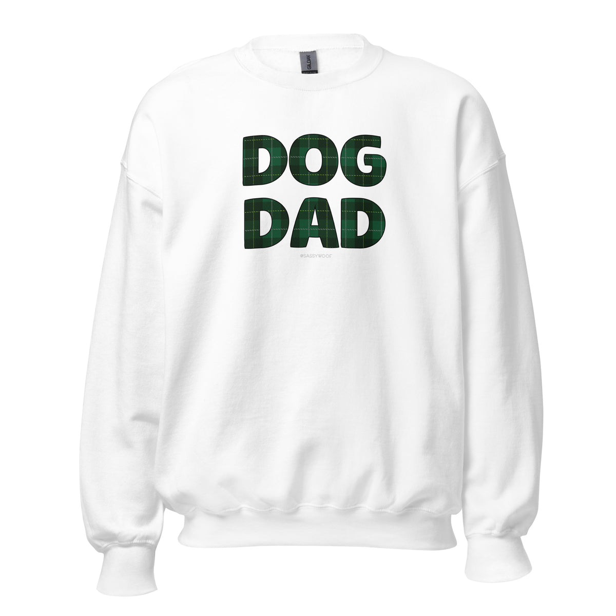 The Sassy Woof "Sweatshirt Dog Dad Barks of Holly" is a cozy, pre-shrunk white sweatshirt featuring bold DOG DAD text in dark green plaid across the front.