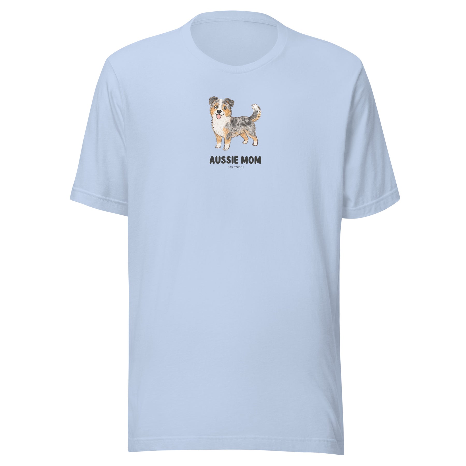 The Aussie Mom Tee by Sassy Woof is a light blue unisex cotton t-shirt with an Australian Shepherd illustration above bold “AUSSIE MOM” text—a perfect gift for proud Aussie dog lovers.