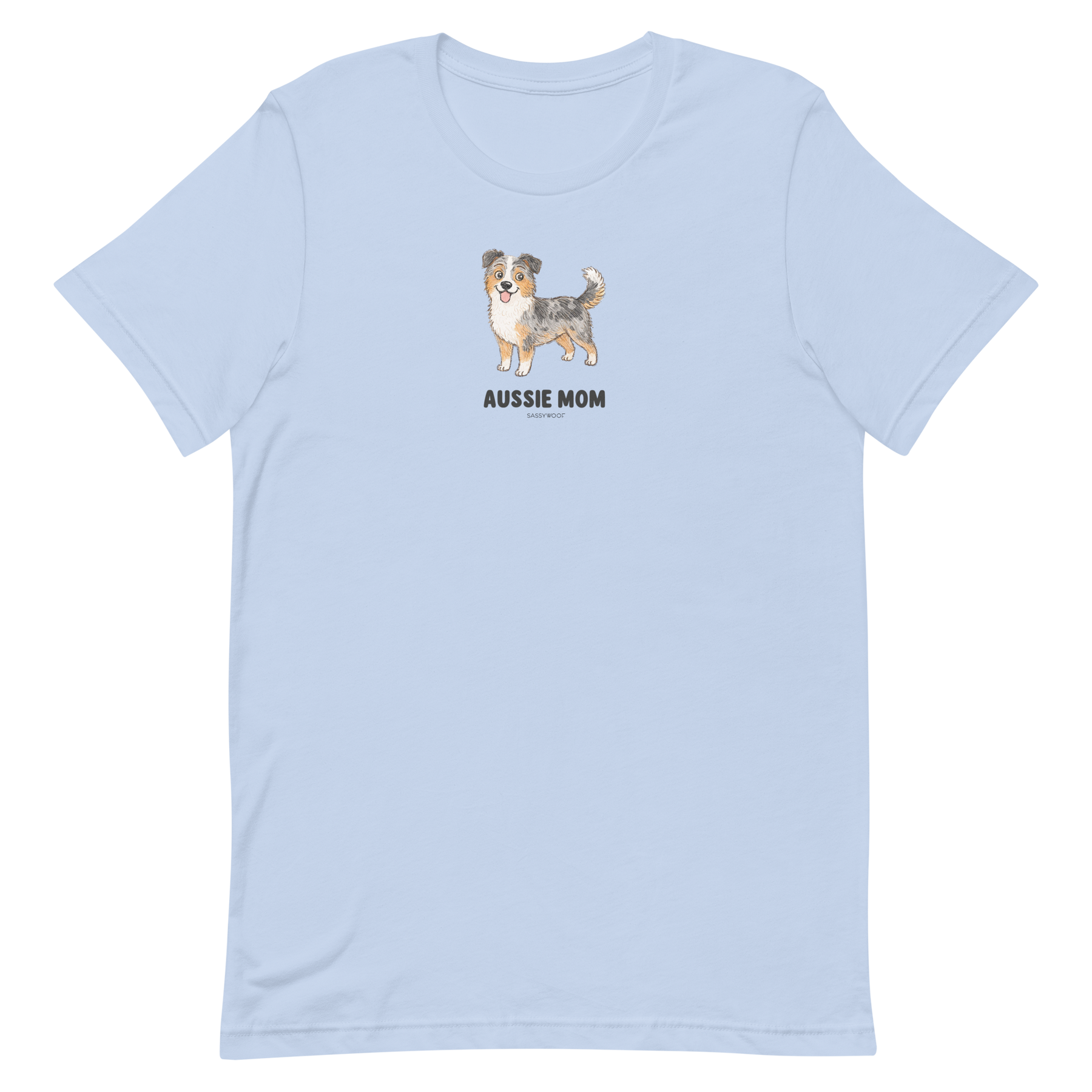The Aussie Mom Tee by Sassy Woof is a light blue, eco-friendly cotton unisex shirt featuring a centered Australian Shepherd illustration and bold black lettering—a perfect pick for proud dog lovers.