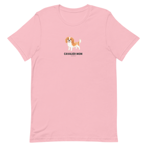 The Sassy Woof Cavalier Mom Tee is a light pink unisex shirt with a cute brown and white Cavalier King Charles Spaniel and bold "CAVALIER MOM" text—ideal for proud pup parents.