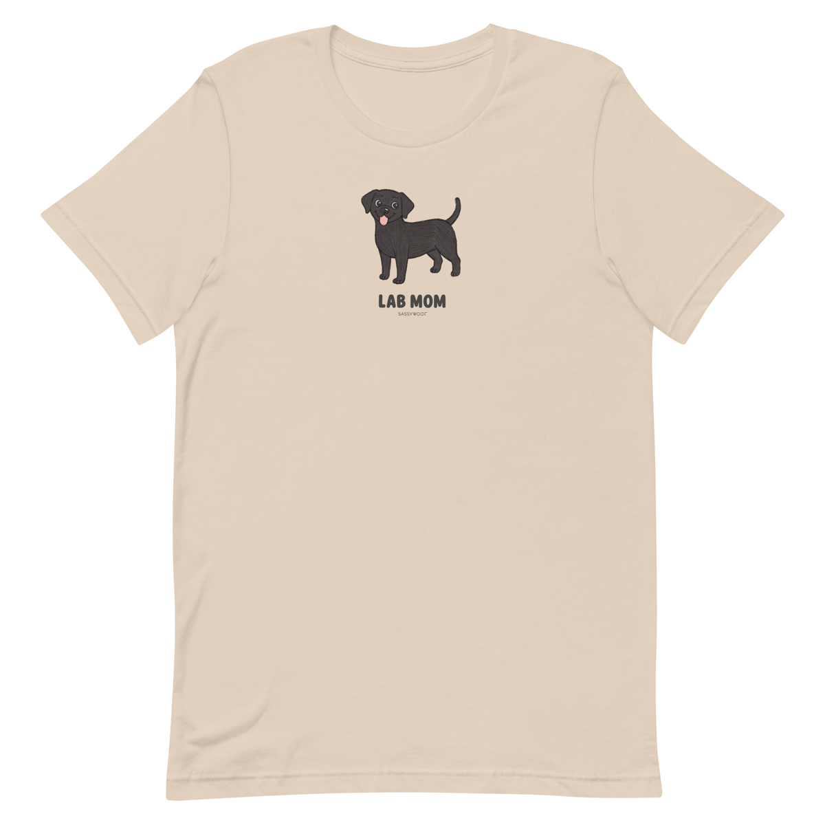 The Sassy Woof Lab Mom Tee is a beige unisex shirt with a cartoon black Labrador above "LAB MOM" in bold letters—perfect for Lab lovers.