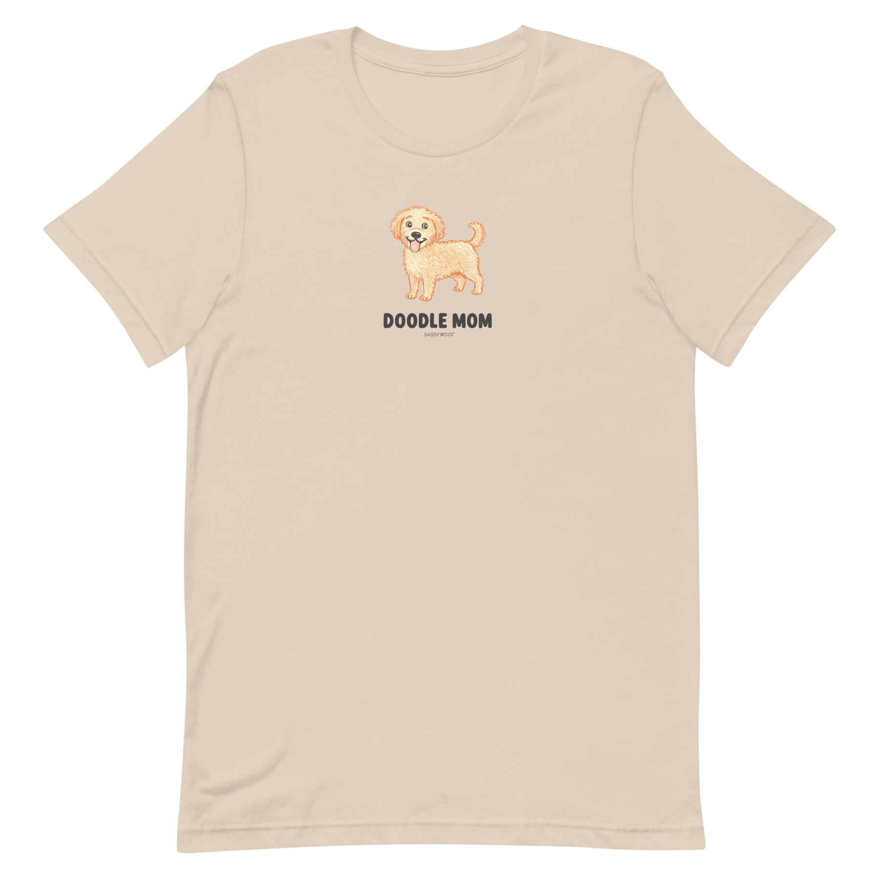 The Doodle Mom Tee by Sassy Woof is a beige unisex shirt featuring a small, smiling dog illustration above bold DOODLE MOM text—perfect for any proud Doodle mom.
