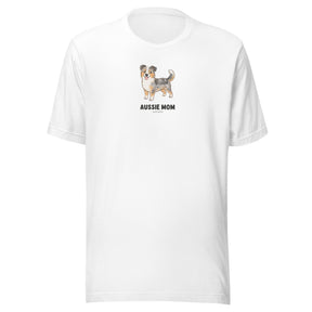 The Sassy Woof Aussie Mom Tee is a white unisex cotton shirt with an Australian Shepherd illustration and bold "AUSSIE MOM" lettering—ideal for proud dog lovers.