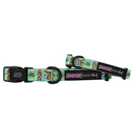 Two adjustable, colorful Sassy Woof Dog Collars - Scooby-Doo™ with cartoon designs, black buckles, and metal leash rings. Each collar pairs perfectly with the matching Sassy Woof dog harness.