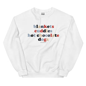 Stay cozy in the Sassy Woof unisex crewneck sweatshirt, featuring "Blankets, Cuddles, Hot Chocolate, Dogs" in blue, red, and brown, with a small Sassy Woof logo below for a comfy and stylish cold-weather look.
